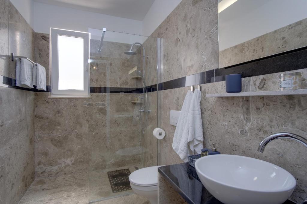 Kúpeľňa v ubytovaní Apartment Medea, St. Martin