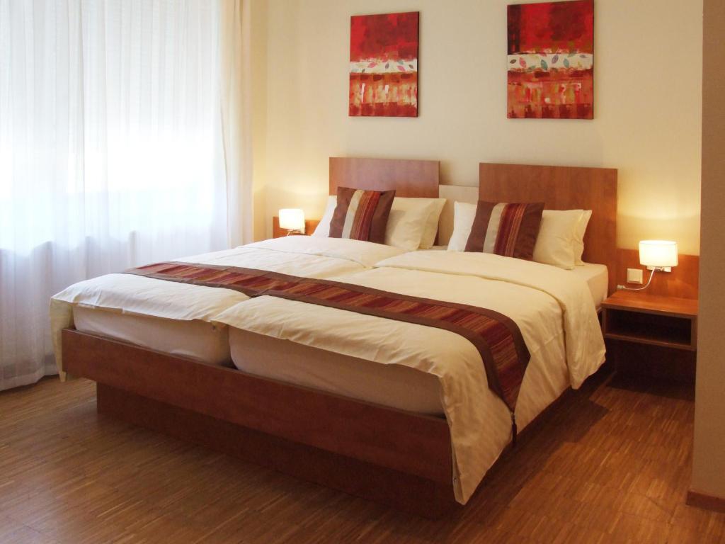 Postel nebo postele na pokoji v ubytování Boutique Hotel Wolfsburg