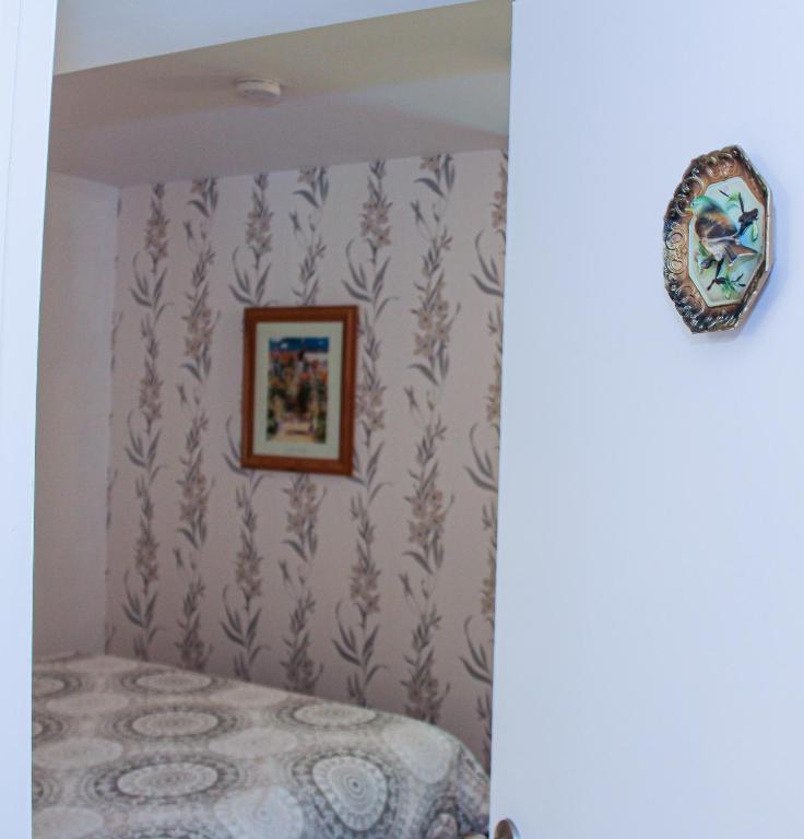 a bedroom with a bed and a picture on the wall at Cedar Drive Inn in Crysler