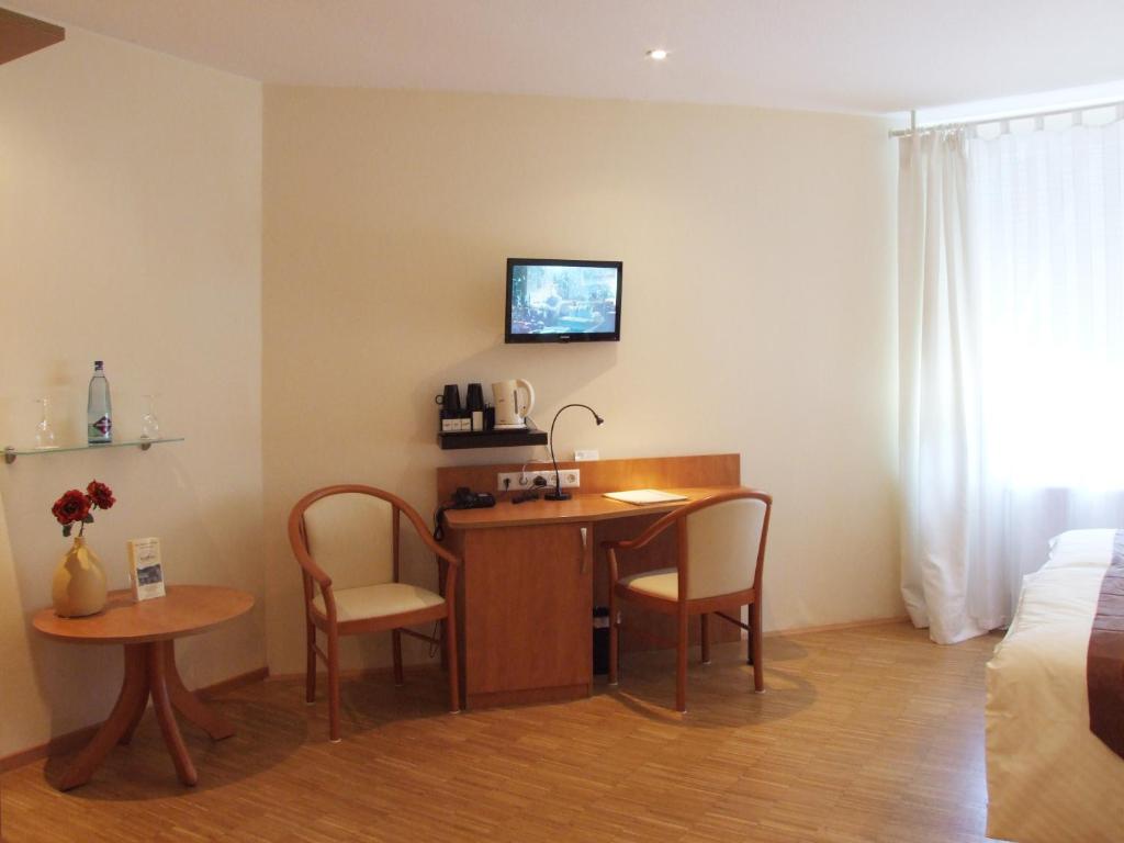 TV a/nebo společenská místnost v ubytování Boutique Hotel Wolfsburg