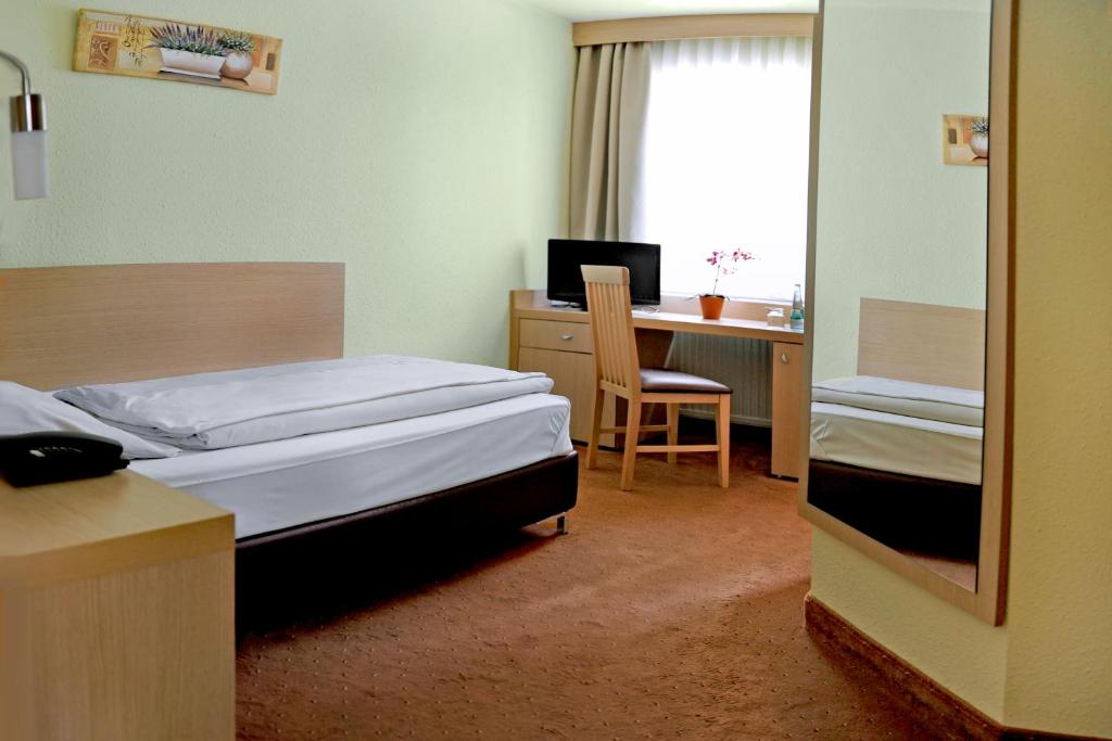 Voodi või voodid majutusasutuse Hotel Tannenhof toas