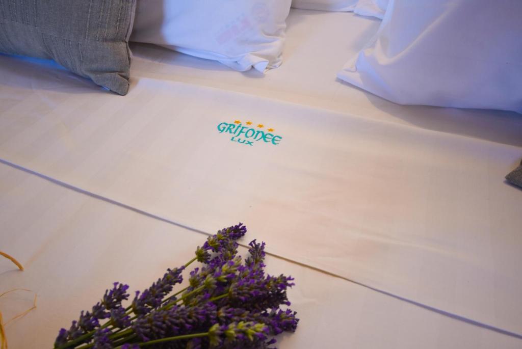 Postel nebo postele na pokoji v ubytování Apartments Grifone Lux