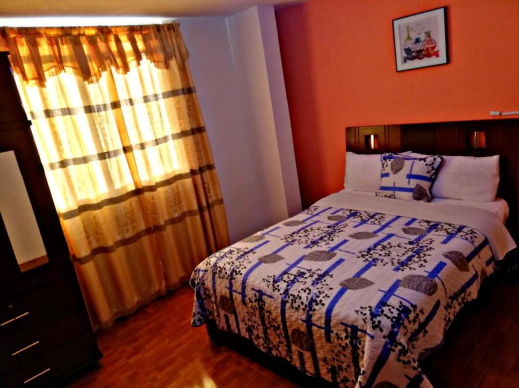 Postel nebo postele na pokoji v ubytování Hostal Mariscal Sucre