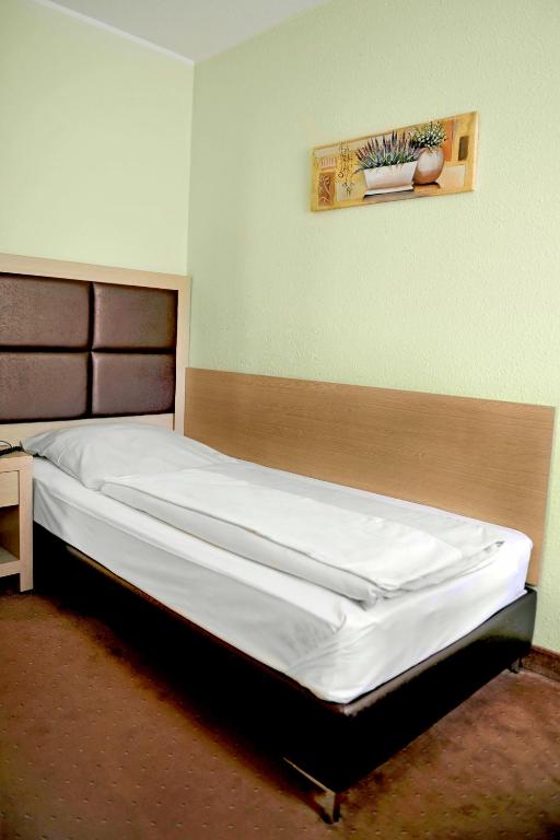 Voodi või voodid majutusasutuse Hotel Tannenhof toas