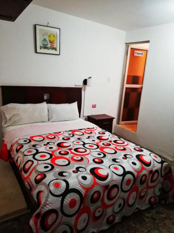 Postel nebo postele na pokoji v ubytování Hostal Mariscal Sucre