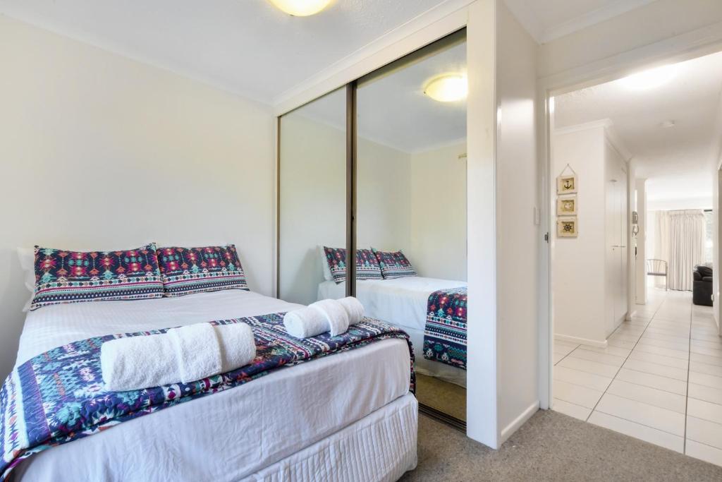 Postel nebo postele na pokoji v ubytování La Mer Apartments