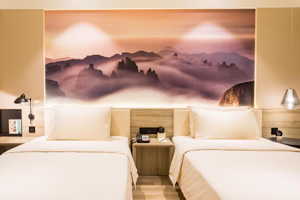 Postel nebo postele na pokoji v ubytování Atour Hotel Qingdao Airport Chengyang Wanxianghui