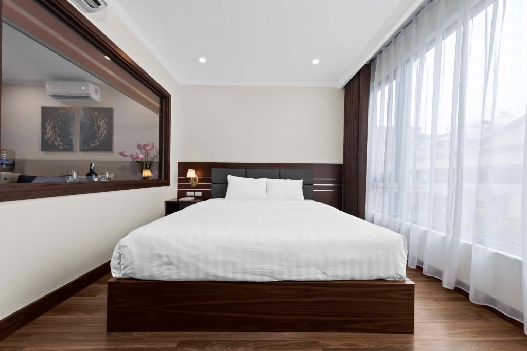 Postel nebo postele na pokoji v ubytování Newsky Serviced Apartment