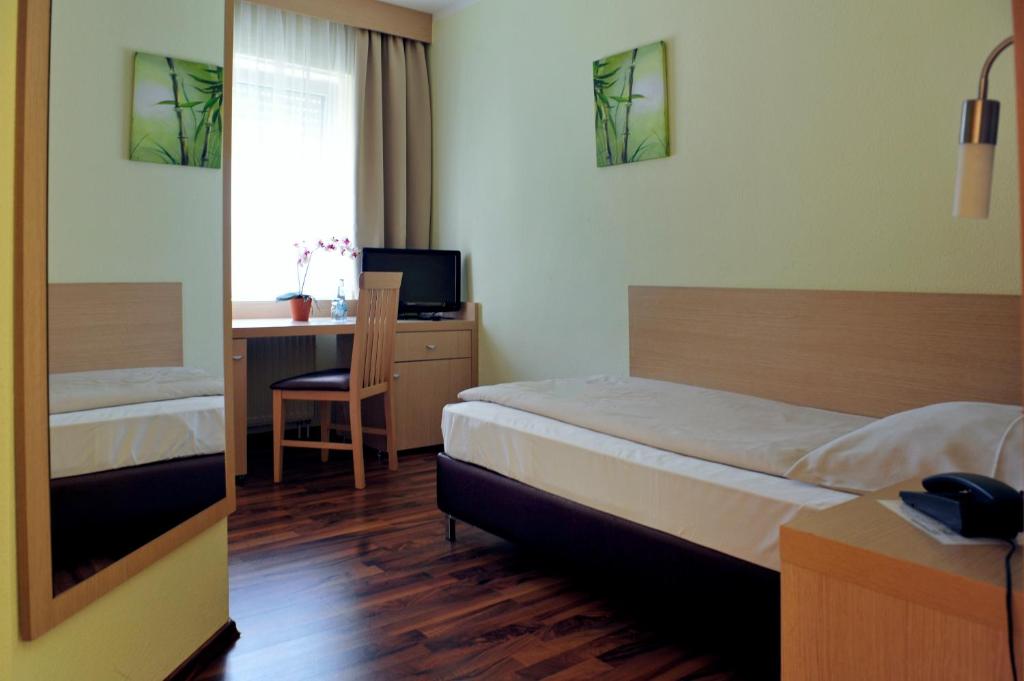 Voodi või voodid majutusasutuse Hotel Tannenhof toas