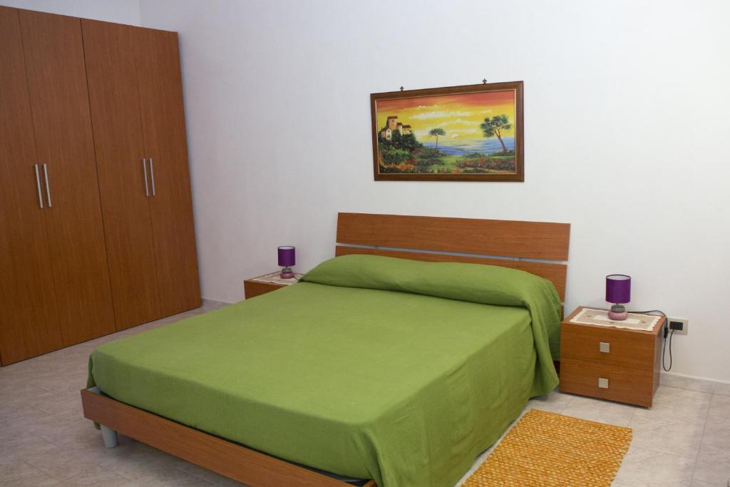 Posteľ alebo postele v izbe v ubytovaní Casa Vacanze Calafarina