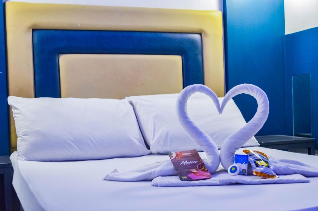 Postel nebo postele na pokoji v ubytování Hotel 99 Quiapo