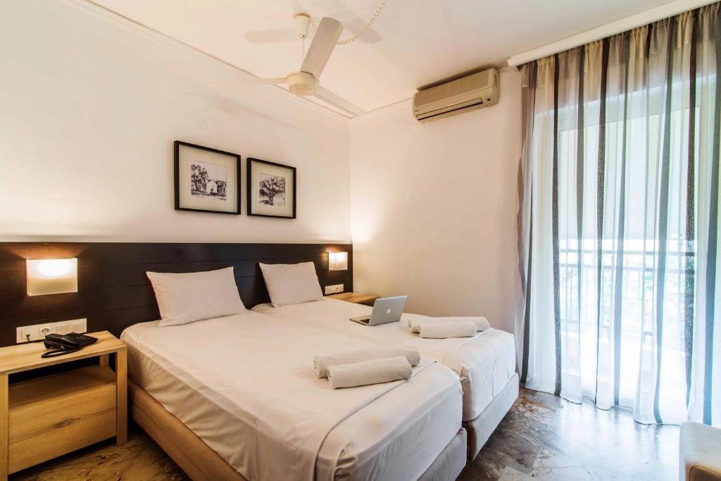Katil atau katil-katil dalam bilik di Polydoros Hotel Apartments