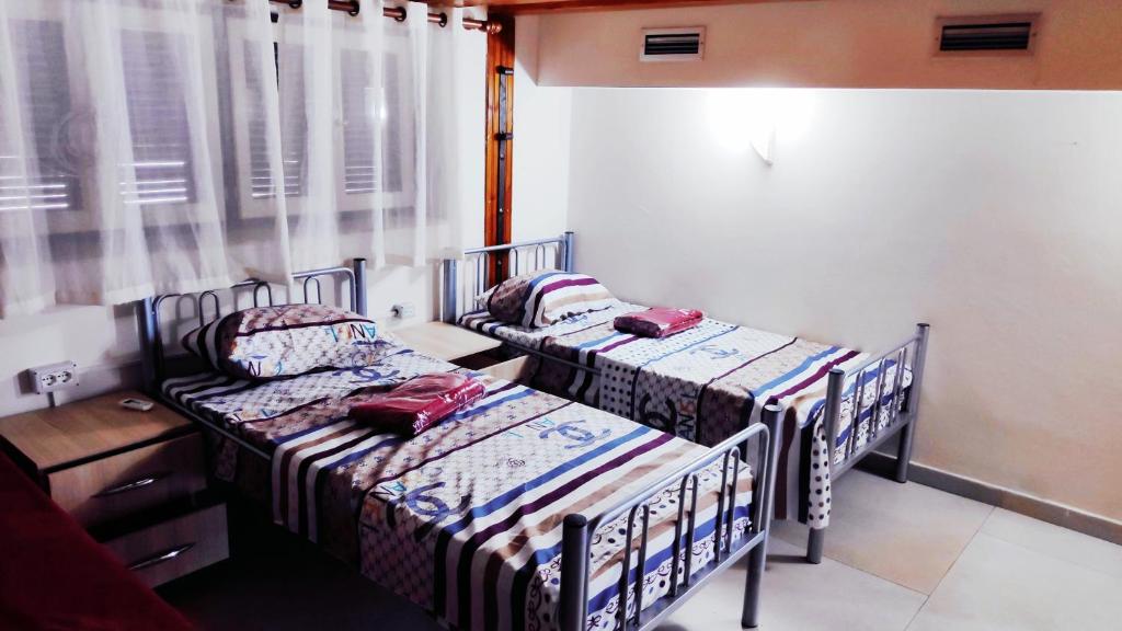 Letto o letti in una camera di Tufina Hostel