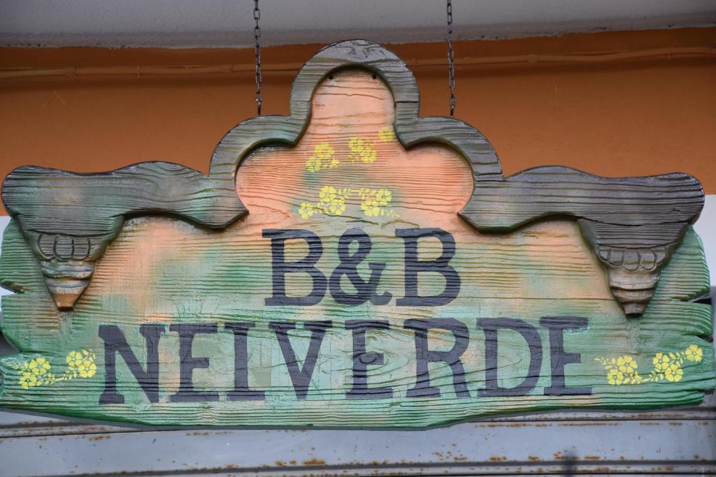 a sign that reads dadnielegate hanging from a building at B&B NEL VERDE in Montesano sulla Marcellana