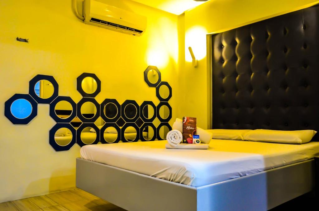 Postel nebo postele na pokoji v ubytování Hotel 99 Monumento