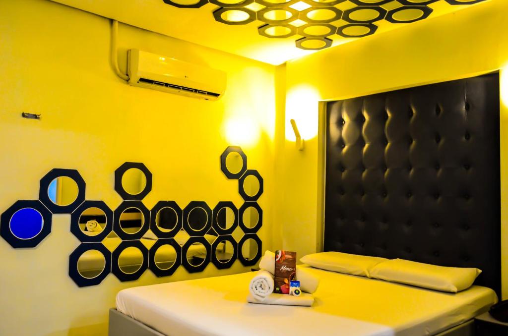 Postel nebo postele na pokoji v ubytování Hotel 99 Monumento