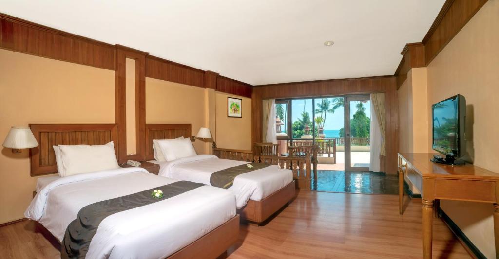 Postel nebo postele na pokoji v ubytování Aloha Resort