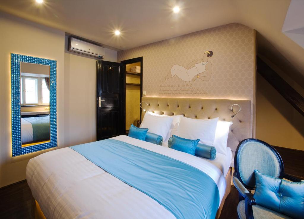 Łóżko lub łóżka w pokoju w obiekcie Design Hotel Jewel Prague