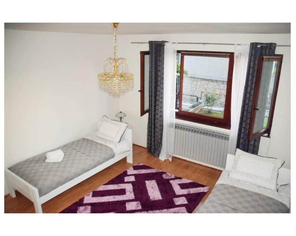 Кровать или кровати в номере Apartmani Baljak