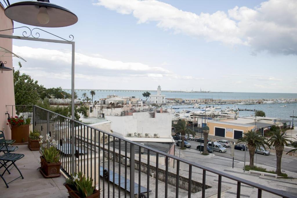 a balcony with a view of a harbor at La Dolce Vista - B&B di Charme in Manfredonia