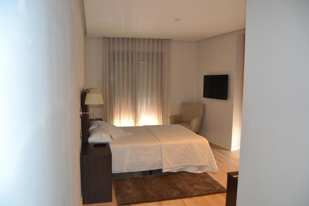 Postel nebo postele na pokoji v ubytování Hotel Villegas