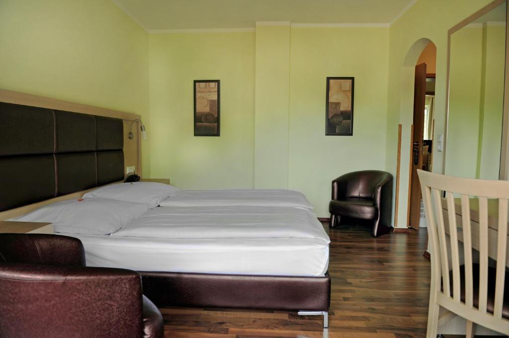 Voodi või voodid majutusasutuse Hotel Tannenhof toas