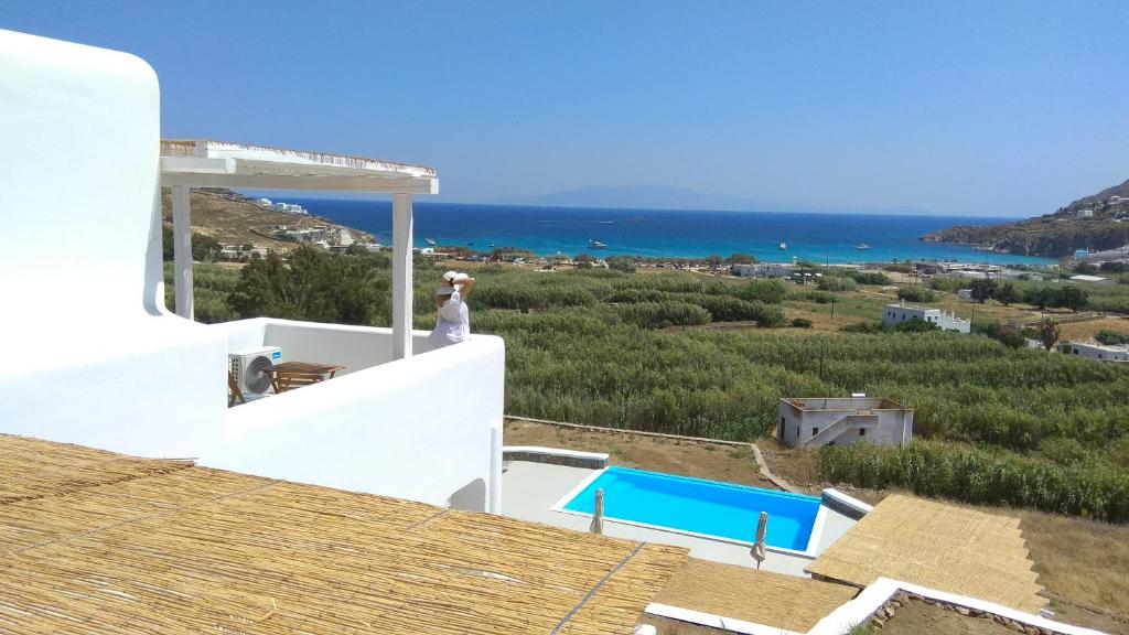 a view of the ocean from the roof of a house at Mykonos4Islands Seaside Apartments in Kalo Livadi