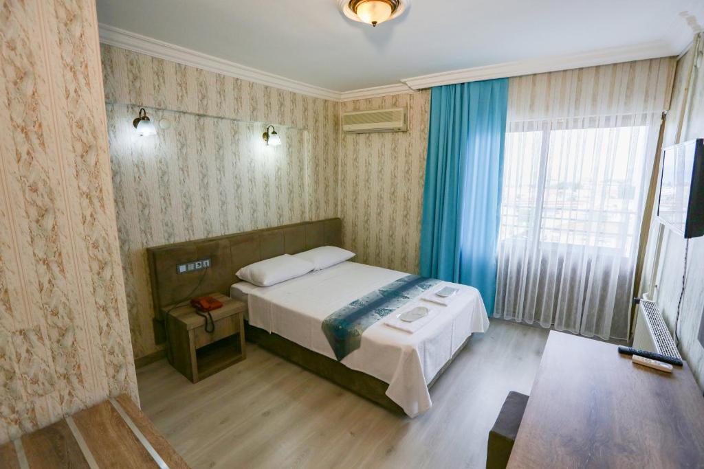 Postel nebo postele na pokoji v ubytování Cagdas Hotel