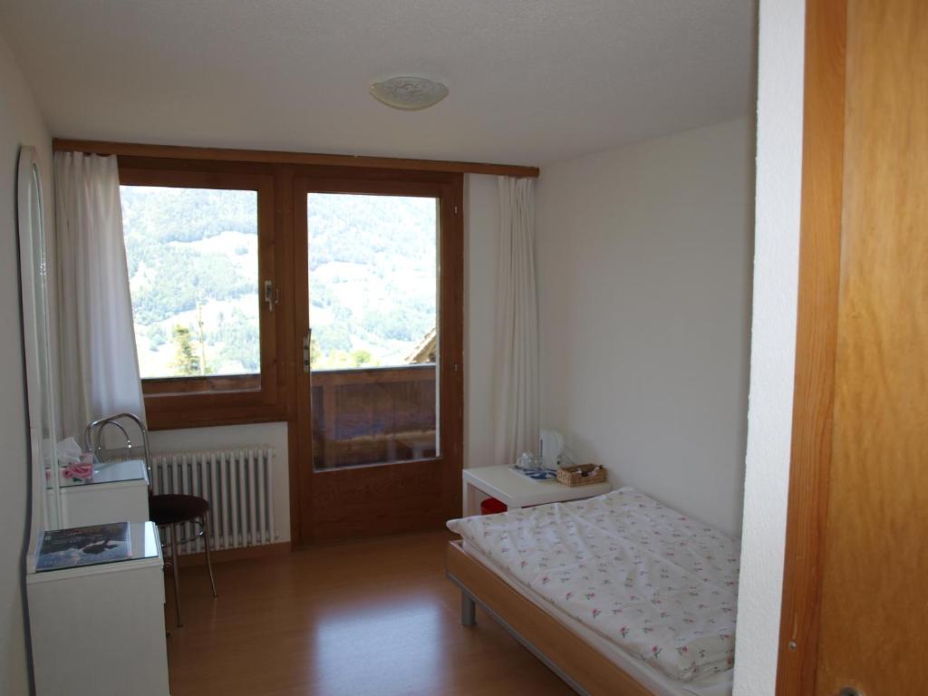 Postel nebo postele na pokoji v ubytování Gasthof Engelberg