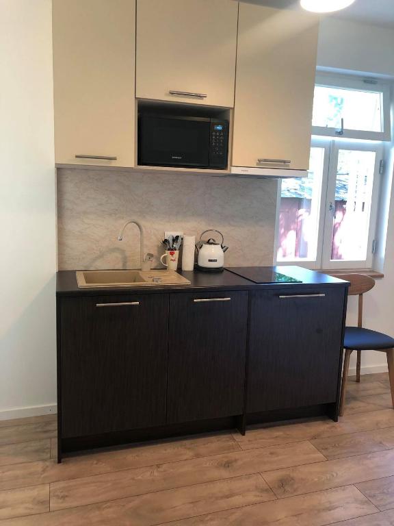 Kuchyň nebo kuchyňský kout v ubytování Nõmme Apartments