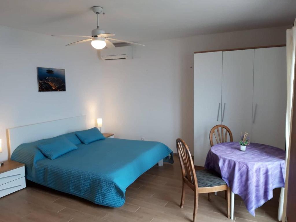Postel nebo postele na pokoji v ubytování Apartment Marika