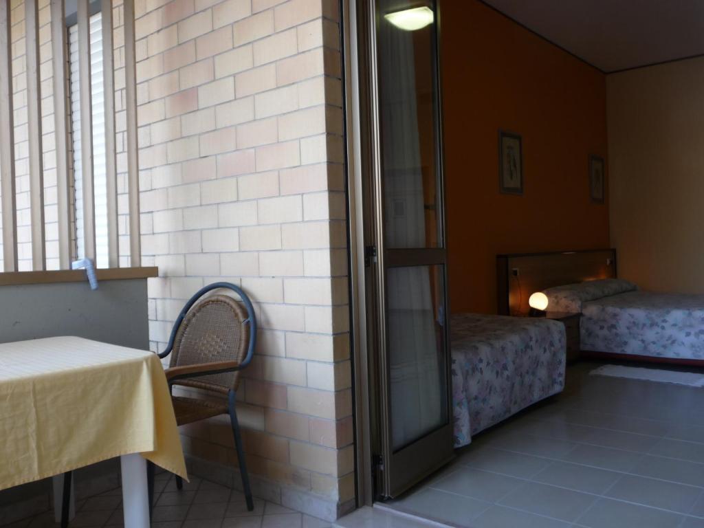 A bed or beds in a room at Hotel Naxos B&B