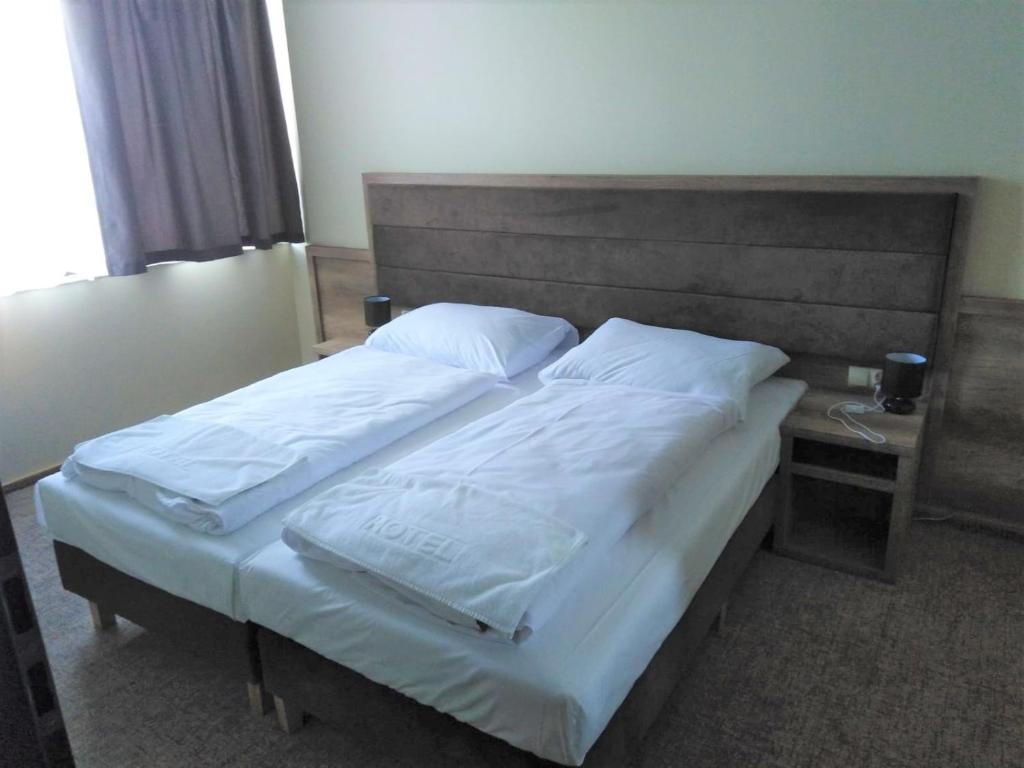 Postel nebo postele na pokoji v ubytování Hotel Cargo