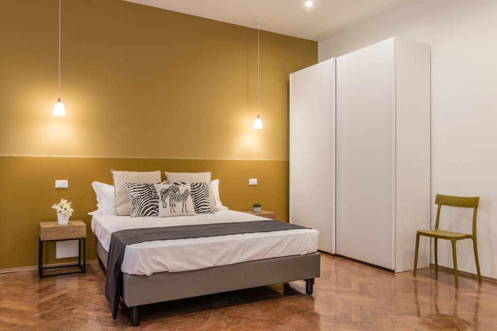 Posteľ alebo postele v izbe v ubytovaní Elegante appartamento da 6 Blu&Oro