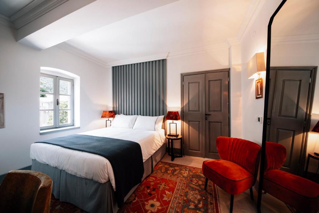 Ένα ή περισσότερα κρεβάτια σε δωμάτιο στο Palazzo Sbutega