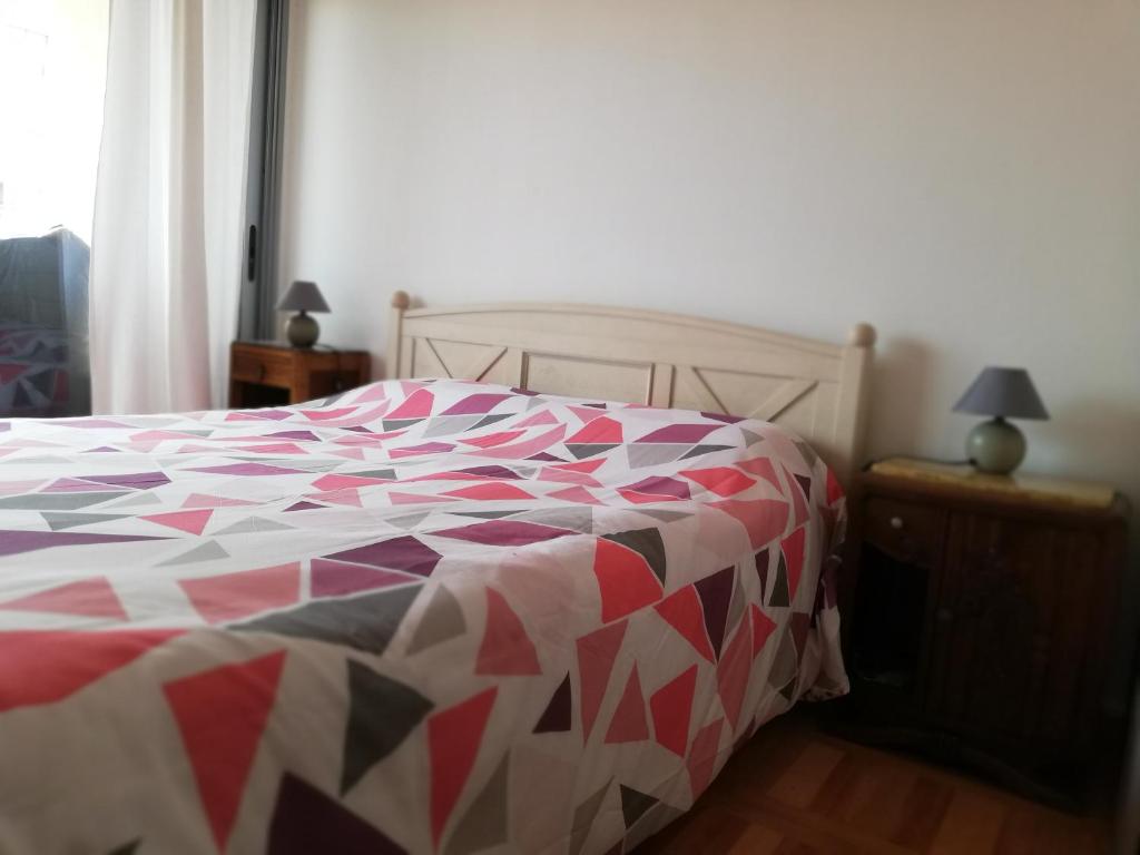 Кровать или кровати в номере Appartement proche Commodités-PORT