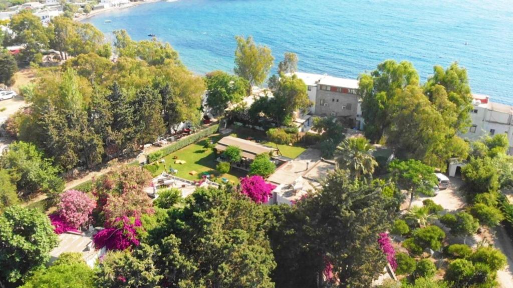an aerial view of a park next to the water at myndos bed & breakfast in Bodrum City
