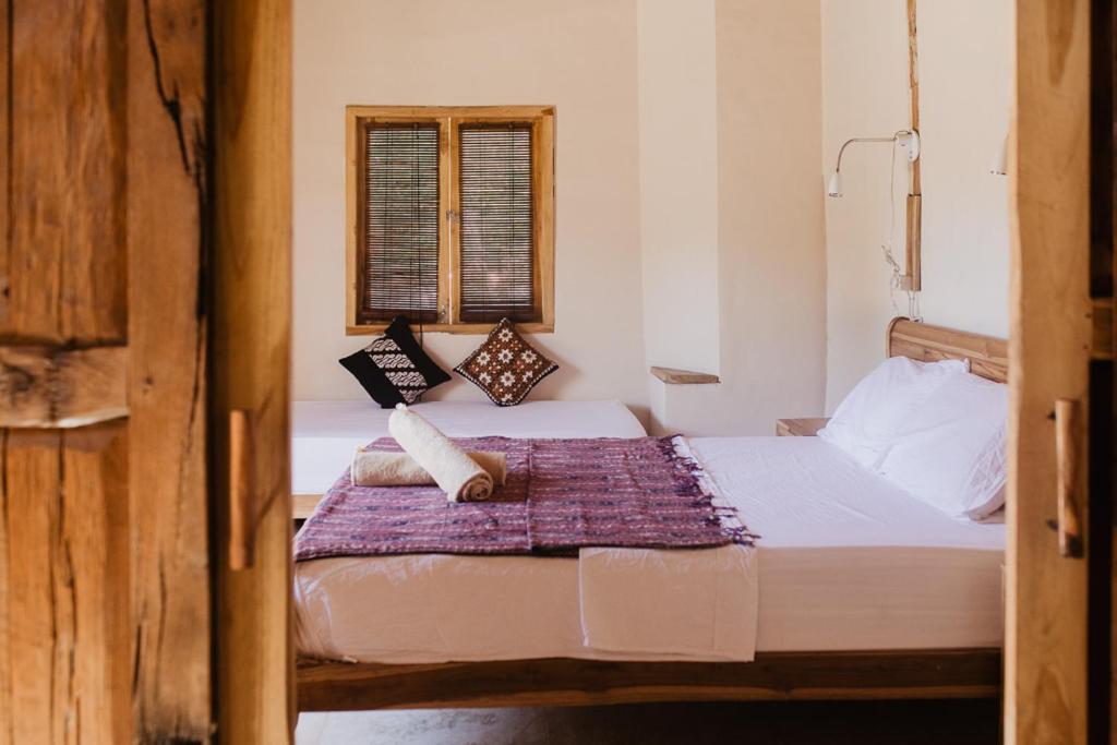 Postel nebo postele na pokoji v ubytování Kalyssa Beach Bungalows