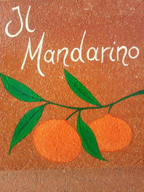 uma pintura de duas laranjas com as palavras marmite em Appartamento Il Mandarino em Pomonte