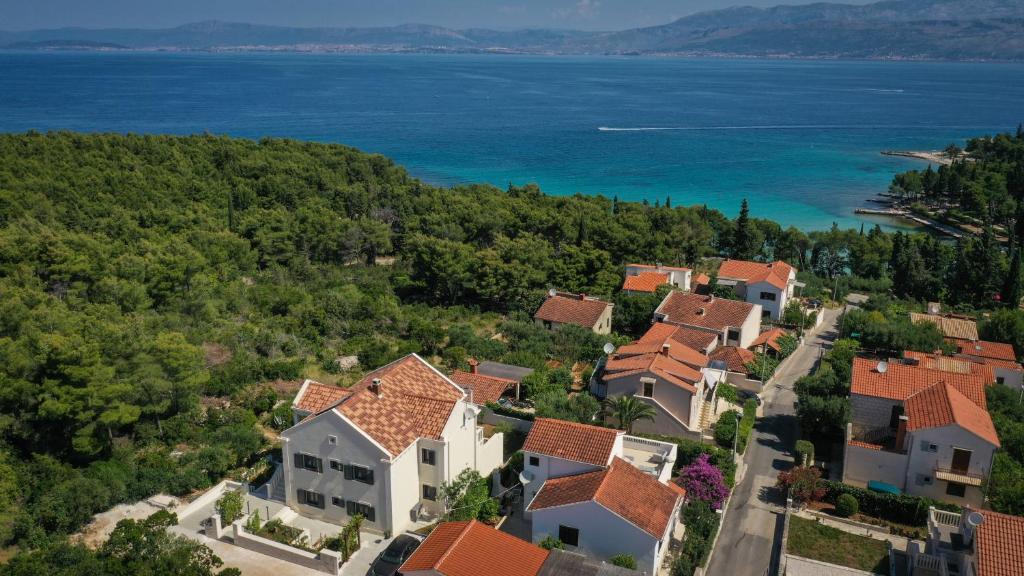 an aerial view of a villa in a resort near the ocean at Ocean's Serenity in Supetar