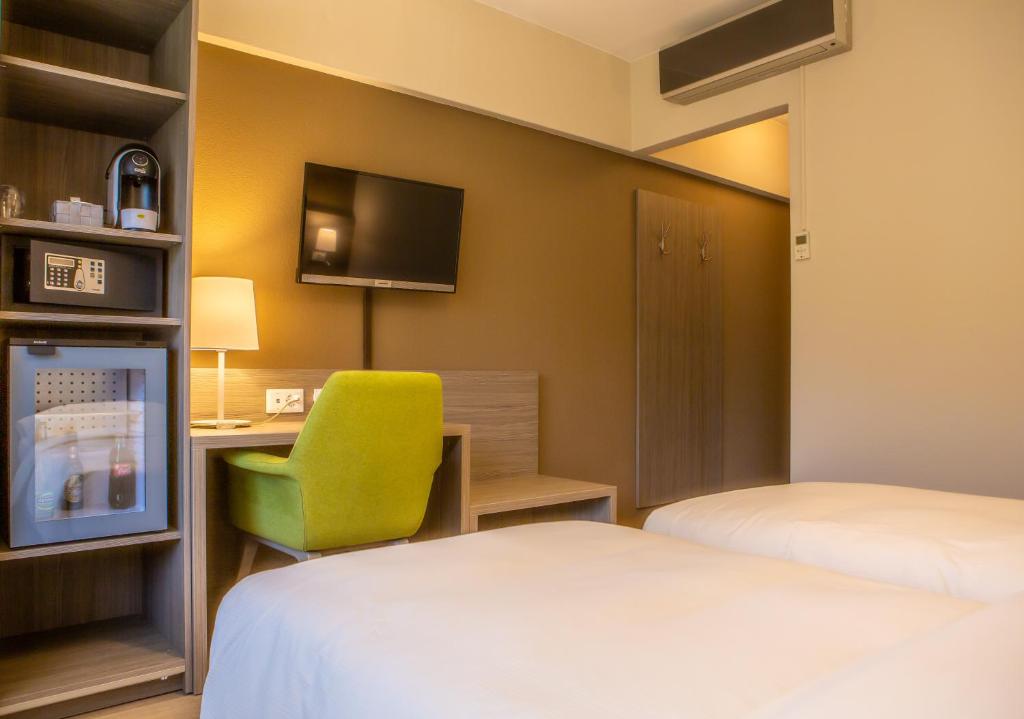 Postel nebo postele na pokoji v ubytování Hotel Unione