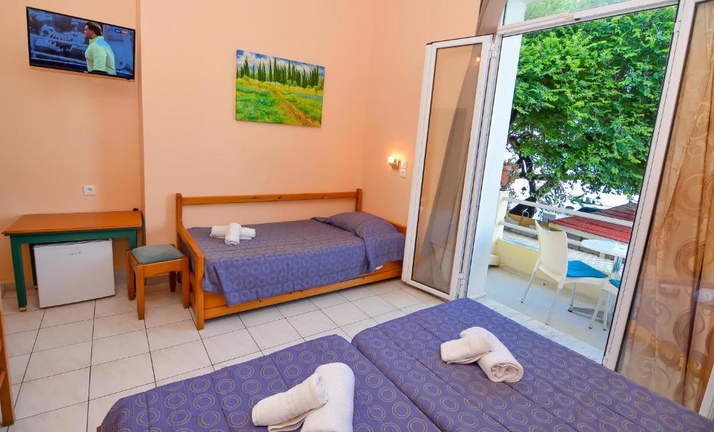 Postel nebo postele na pokoji v ubytování Costa Hotel