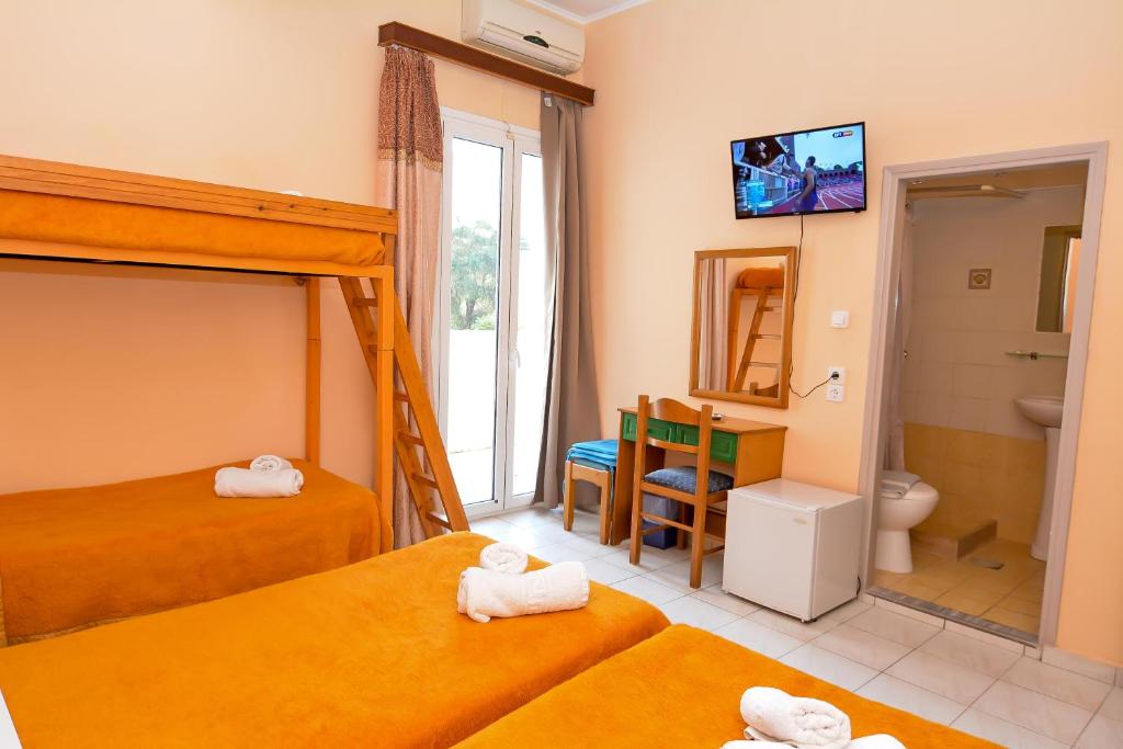 Postel nebo postele na pokoji v ubytování Costa Hotel