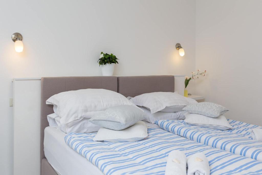 Posteľ alebo postele v izbe v ubytovaní Split Center Suites