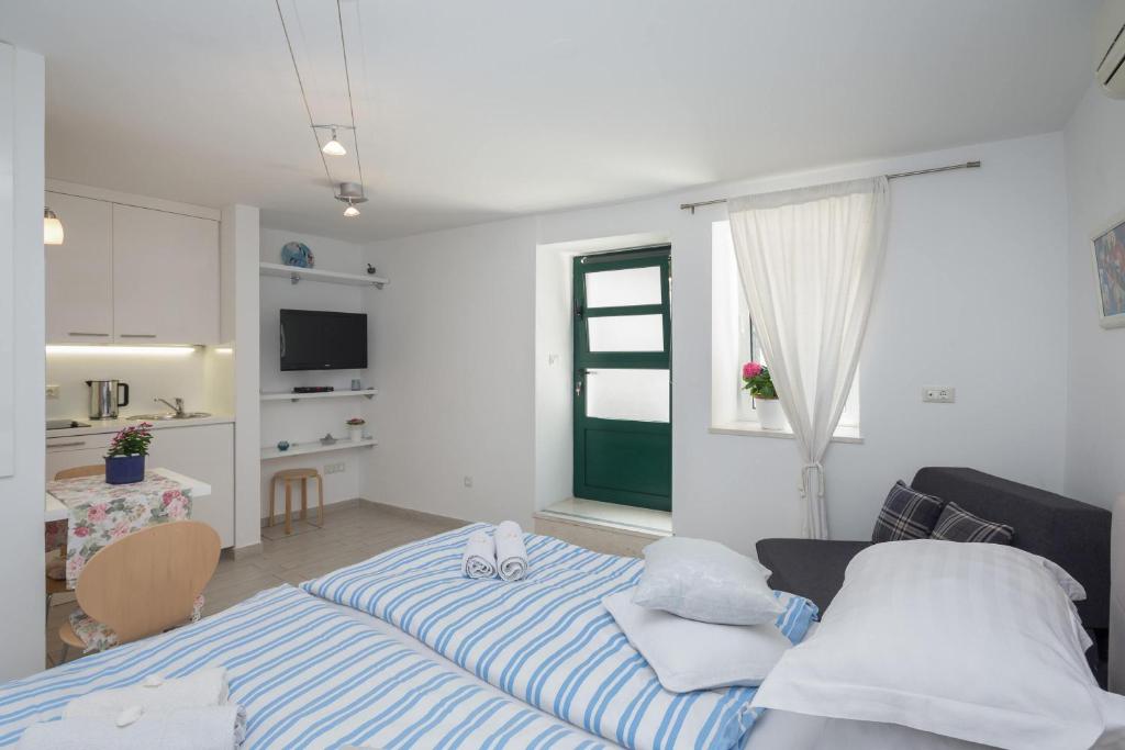 Posteľ alebo postele v izbe v ubytovaní Split Center Suites