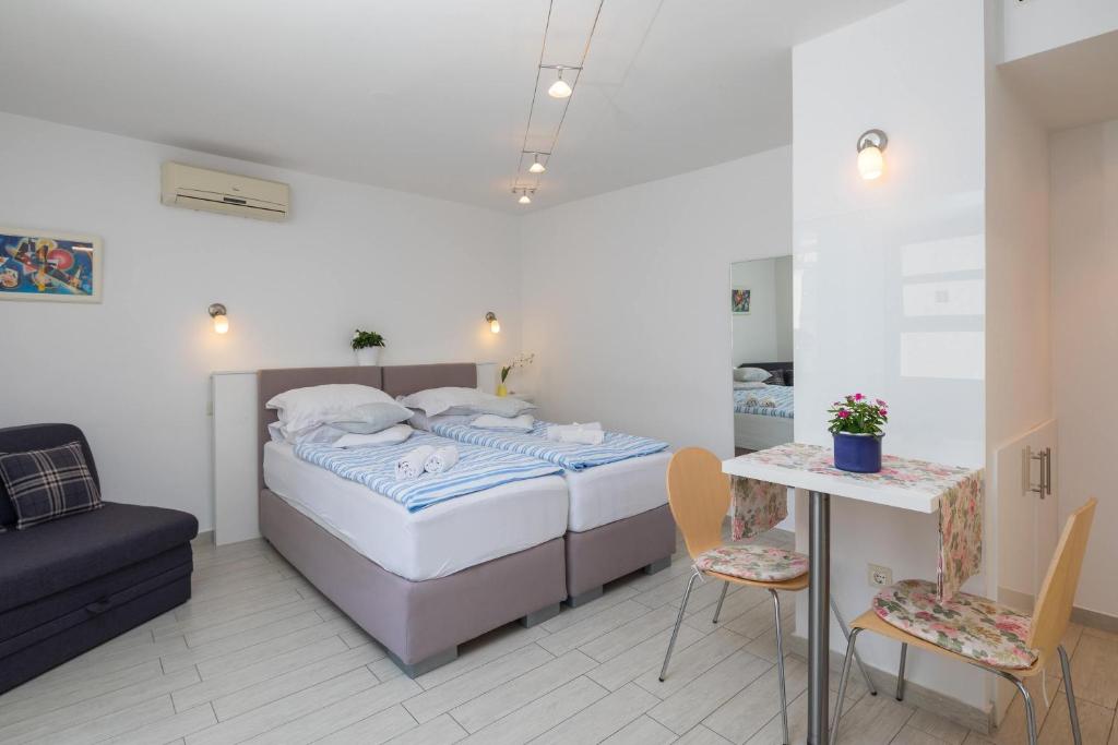 Posteľ alebo postele v izbe v ubytovaní Split Center Suites