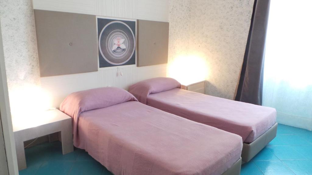 Postel nebo postele na pokoji v ubytování Albergo Villa Anna