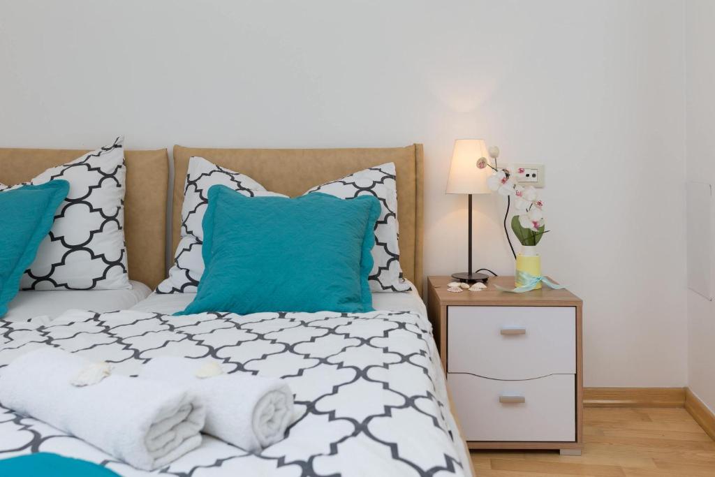 Posteľ alebo postele v izbe v ubytovaní Split Center Suites