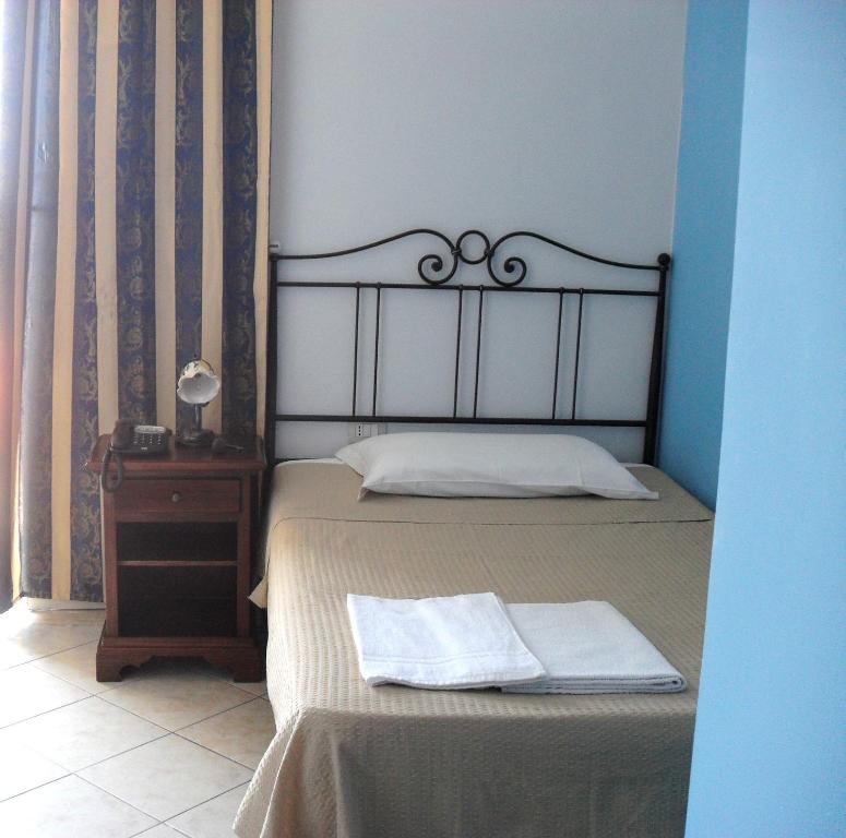 Posteľ alebo postele v izbe v ubytovaní Hotel Piro