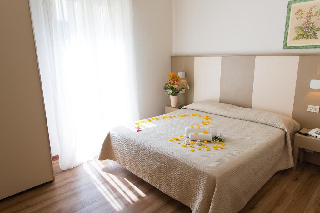Postel nebo postele na pokoji v ubytování Hotel Giulietta
